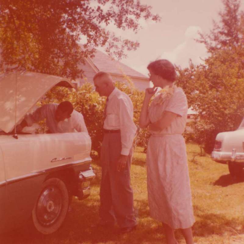 Joe Nester, Bill Rasberry's son-in-law, checking the oil before Bill and Moddie's honeymoon trip