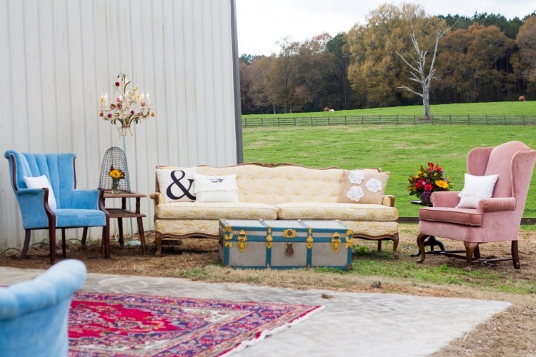 Vintage furniture seating area at wedding from Lovegood Wedding & Event Rentals collection