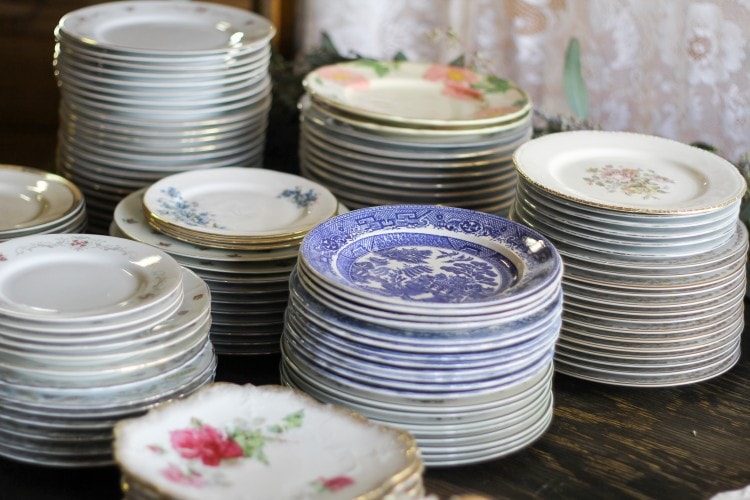 Vintage mismatched dishes for wedding reception, from Lovegood Wedding & Event Rentals collection