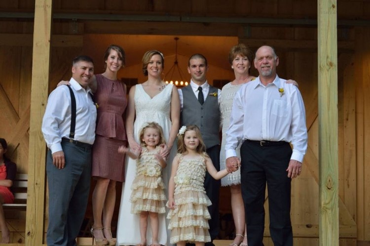 Bride & Groom's families at outdoor wedding reception